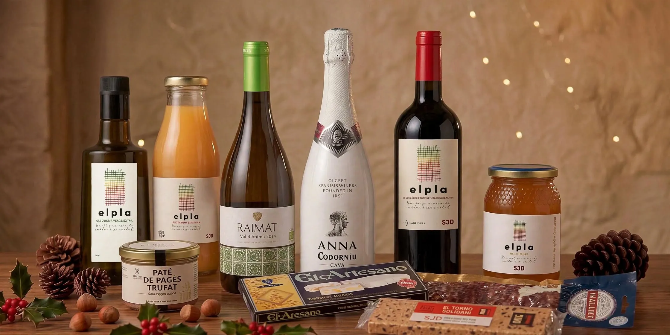 Lot Bàsic: oli d'oliva El Pla, suc, vi blanc Raimat, cava Anna de Codorníu, vi negre El Pla, mel, paté de pagès trufat, torrons i llonganissa